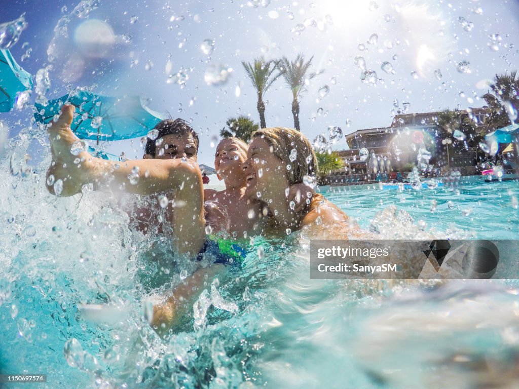 Splashing Pool Family Splashing In Swimming Pool High-Res Stock Photo - Getty Images