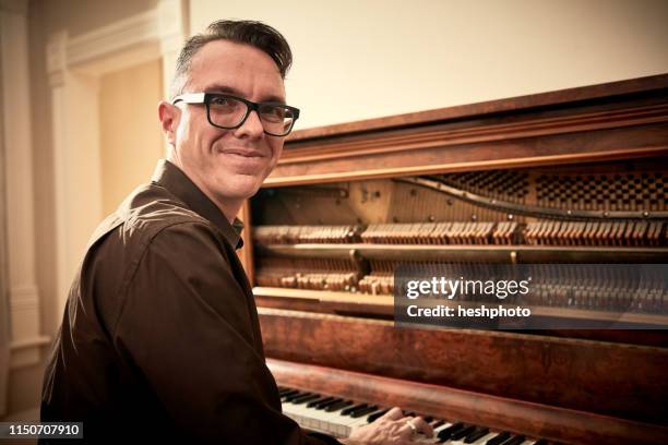 man smiling and playing piano - pianist portrait stock pictures, royalty-free photos & images