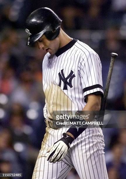 New York Yankees shortstop Derek Jeter hangs his head after striking out in the bottom of the ninth inning against the Detroit Tigers 22 September,...