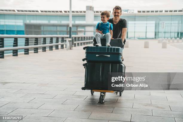 family at the airport - luggage trolley stock pictures, royalty-free photos & images