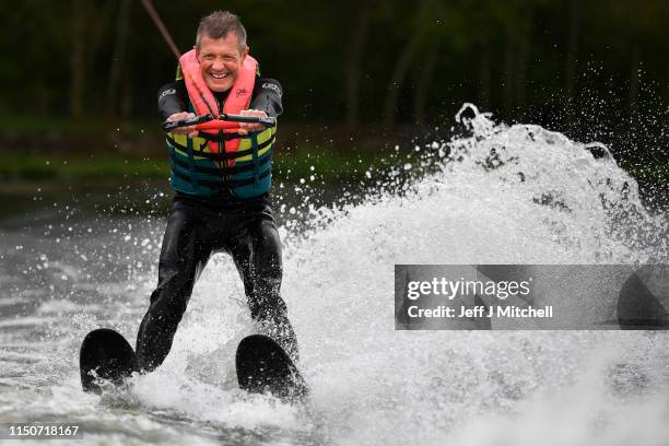 Willie Rennie leader of the Scottish Liberal Democrats, water skies during a European Election campaign event at Water Ski & Wakeboard Scotland on...