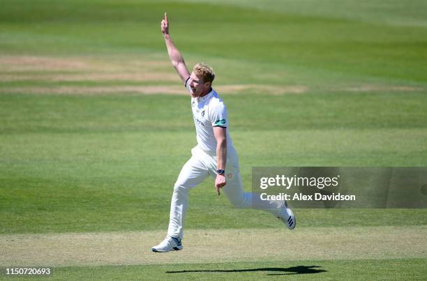 Liam Norwell of Warwickshire celebrate the wicket of Tom Abell of Somerset during Day Two of the Specsavers County Championship match between...
