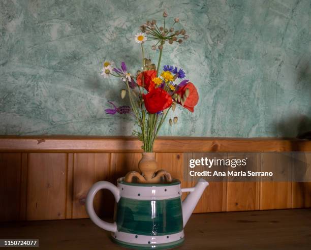 a vase with wild blue, red yellow and white wild flowers - poppies in vase stock pictures, royalty-free photos & images