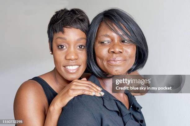 a portrait of a mother and daughter - family formal portrait stock pictures, royalty-free photos & images