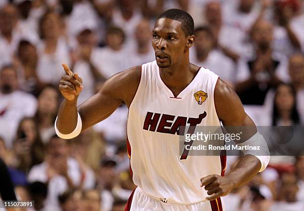 Chris Bosh of the Miami Heat reacts against the Dallas Mavericks in the first quarter of Game Two of the 2011 NBA Finals at American Airlines Arena...