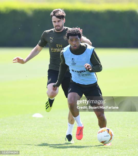 Carl Jenkinson and Xavier Amaechi of Arsenal during a training session at London Colney on May 21, 2019 in St Albans, England.