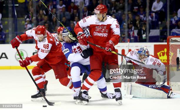 Marko Dano of Slovakia challenge Nicholas Jensen and Oliver Lauridsen of Denmark during the 2019 IIHF Ice Hockey World Championship Slovakia group A...