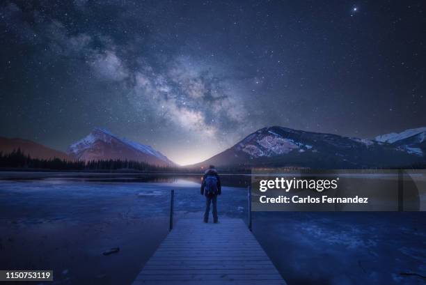 man under milky way - looking up at stars stock pictures, royalty-free photos & images