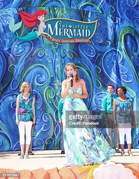 In this handout image provided by Disney Parks, Jodi Benson performs 'Part of Your World' during the grand opening ceremony for 'The Little Mermaid ~...