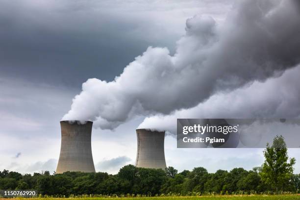 smoke pollution flows from an industrial smoke stack chimney - power station stock pictures, royalty-free photos & images