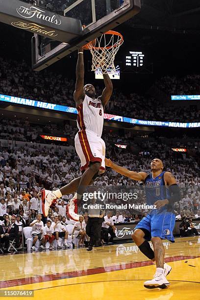 LeBron James of the Miami Heat drives for a shot attempt against Shawn Marion of the Dallas Mavericks in Game Two of the 2011 NBA Finals at American...