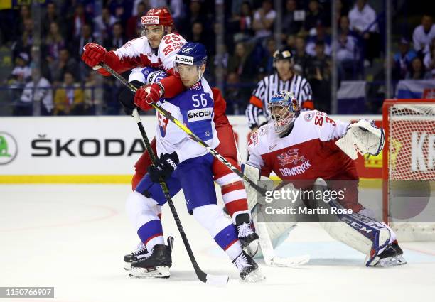 Marko Dano of Slovakia challenges Oliver Lauridsen of Denmark during the 2019 IIHF Ice Hockey World Championship Slovakia group A game between...