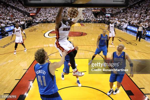 Dwyane Wade of the Miami Heat dunks against Dirk Nowitzki and Jason Kidd of the Dallas Mavericks in Game Two of the 2011 NBA Finals at American...