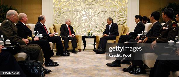 Secretary of Defense Robert Gates meets with Singapore's Defence Minister Ng Eng Hen at the 10th International Institute for Strategic Studies Asia...