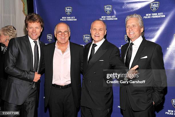 Musicians Jon Bon Jovi and Jimmy Buffett, New York City Police Commissioner Raymond W. Kelly, and actor Michael Douglas attend the 33rd Annual Police...