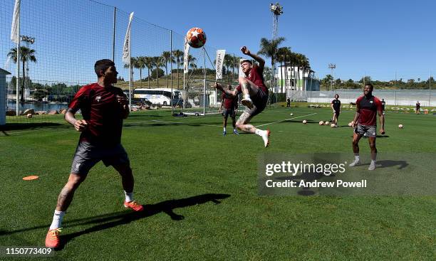 Roberto Firmino and Alberto Moreno of Liverpool during a training session at Marbella Football Centre on May 21, 2019 in Marbella, Spain.