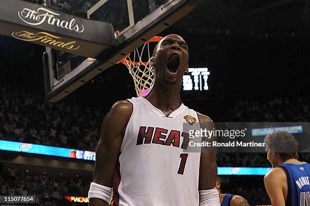 Chris Bosh of the Miami Heat reacts in the fourth quarter while taking on the Dallas Mavericks in Game Two of the 2011 NBA Finals at American...