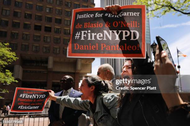 Protesters gather outside of Police Headquarters in Manhattan to protest during the police disciplinary hearing for Officer Daniel Pantaleo, who was...