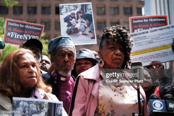 Gwen Carr, mother of Eric Garner, joins others during a news conference outside of Police Headquarters in Manhattan to protest during the police...