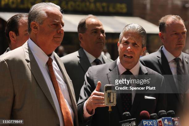 Patrick Lynch, President of the Patrolmen's Benevolent Association, joins others during a news conference outside of Police Headquarters in Manhattan...