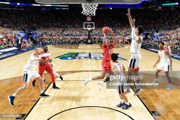 Jarrett Culver of the Texas Tech Red Raiders shoots over Kihei Clark of the Virginia Cavaliers during the 2019 NCAA Photos via Getty Images Men's...