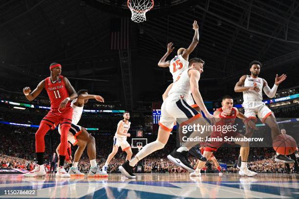 The Virginia Cavaliers defense collapses on Matt Mooney of the Texas Tech Red Raiders during the 2019 NCAA Photos via Getty Images Men's Final Four...