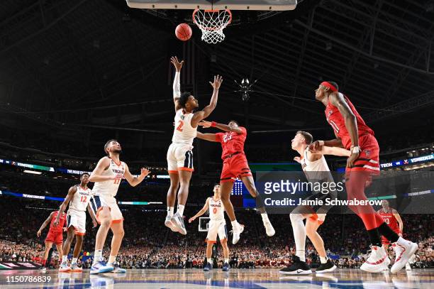 Jarrett Culver of the Texas Tech Red Raiders drives to the hoop against Braxton Key of the Virginia Cavaliers during the 2019 NCAA Photos via Getty...