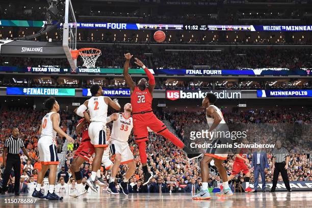 Norense Odiase of the Texas Tech Red Raiders jumps for a rebound against the Virginia Cavaliers during the 2019 NCAA Photos via Getty Images Men's...