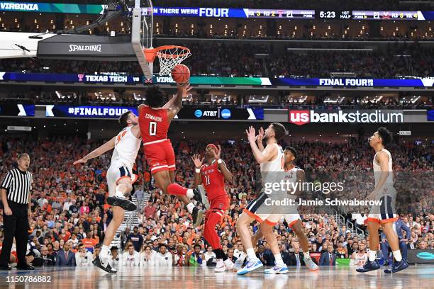 Jay Huff of the Virginia Cavaliers defends Kyler Edwards of the Texas Tech Red Raiders during the 2019 NCAA Photos via Getty Images Men's Final Four...