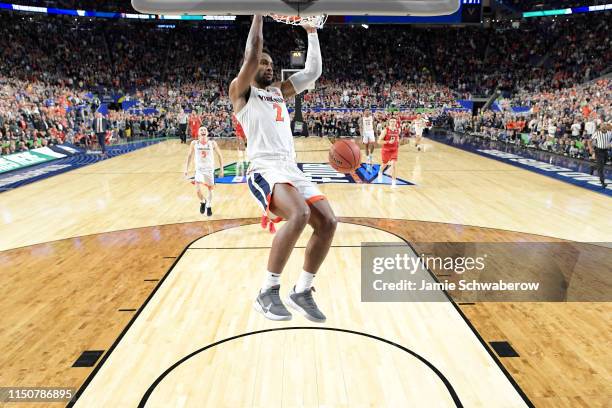 Braxton Key of the Virginia Cavaliers dunks in the closing seconds of the game against the Texas Tech Red Raiders during the 2019 NCAA Photos via...