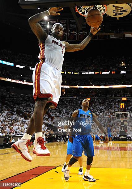 LeBron James of the Miami Heat dunks against DeShawn Stevenson of the Dallas Mavericks in Game Two of the 2011 NBA Finals at American Airlines Arena...