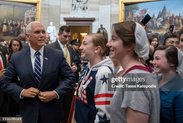 Vice President Mike Pence stops to greet and talk with tourists in the U.S. Capitol Rotunda after the weekly policy luncheons on May 21, 2019 in...