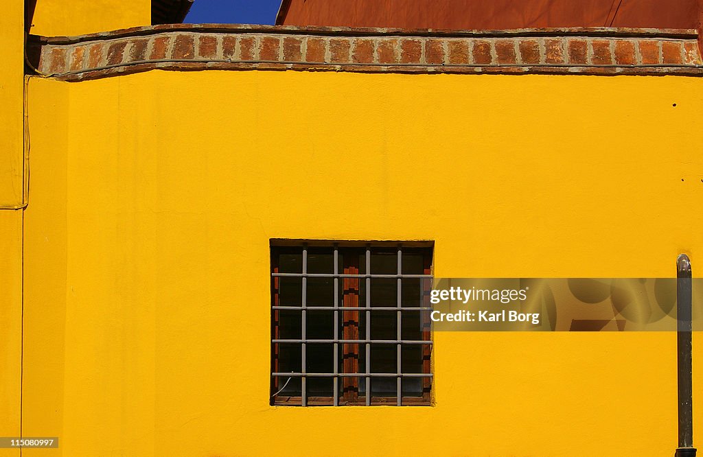 Window in yellow wall