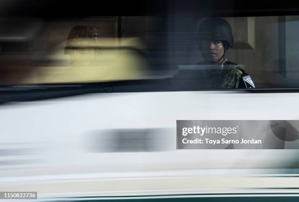 Members of the National Guard stand at a checkpoint in Tuxtla Chico on June 19, 2019 in Chiapas state, Mexico. The Mexican government launched a...