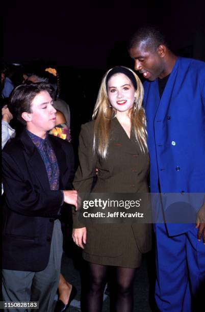 Actor David Faustino, Actress Christina Applegate, and Basketball Player Magic Johnson at the 1990 MTV Video Music Awards at in Los Angeles,...