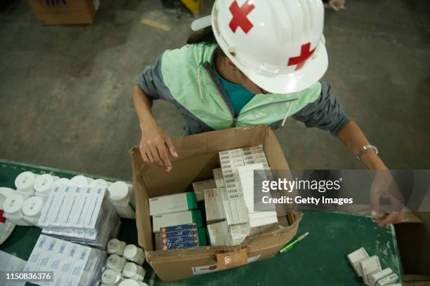 Volunteer repacks medicines in a warehouse of International Committee of the Red Cross on June 19, 2019 in Caracas, Venezuela. A second shipment...