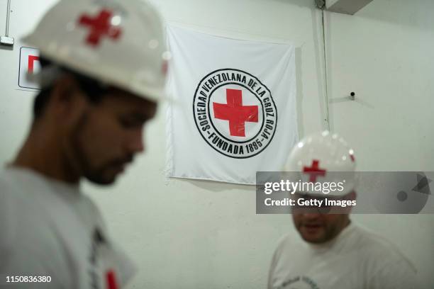 Red Cross volunteers works in a warehouse of International Committee of the Red Cross on June 19, 2019 in Caracas, Venezuela. A second shipment...