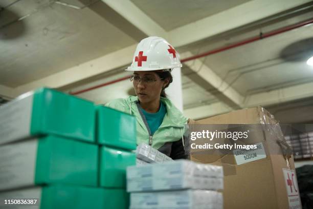 Volunteer repack medicines in a warehouse of International Committee of the Red Cross on June 19, 2019 in Caracas, Venezuela. A second shipment...