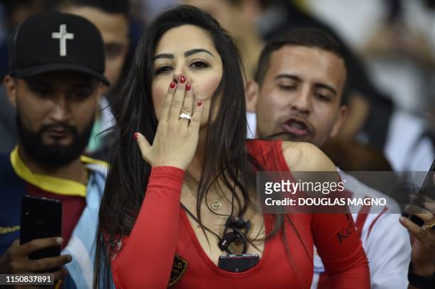 Paraguay's model Larissa Riquelme blows a kiss during the Copa America football tournament group match between Argentina and Paraguay at the Mineirao...