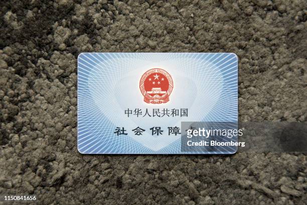 Social welfare card is arranged for a photograph in Suzhou, China, on Monday, May 6, 2019. Suzhou was one of a dozen places chosen in 2018 by...
