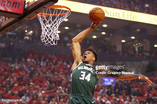Giannis Antetokounmpo of the Milwaukee Bucks dunks the ball during the first half against the Toronto Raptors in game four of the NBA Eastern...