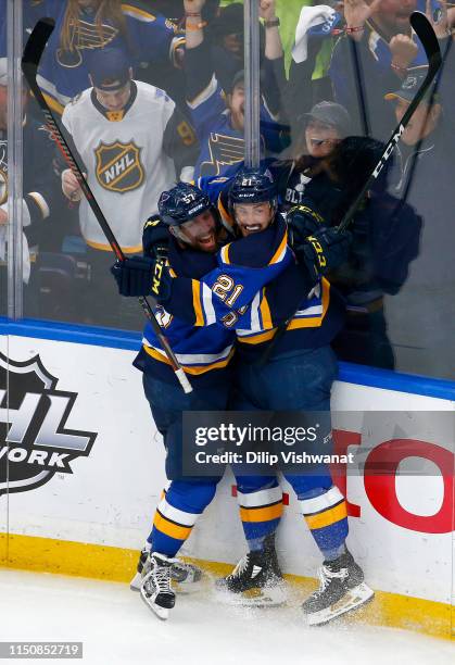 Tyler Bozak of the St. Louis Blues celebrates with David Perron after scoring a goal on Martin Jones of the San Jose Sharks during the third period...