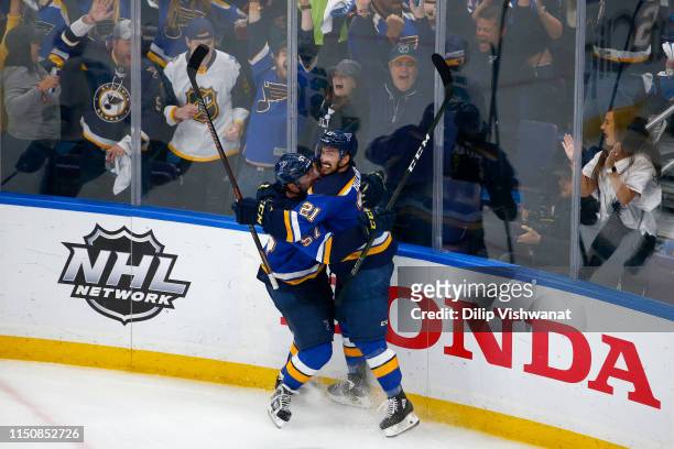 Tyler Bozak of the St. Louis Blues celebrates with David Perron after scoring a goal on Martin Jones of the San Jose Sharks during the third period...