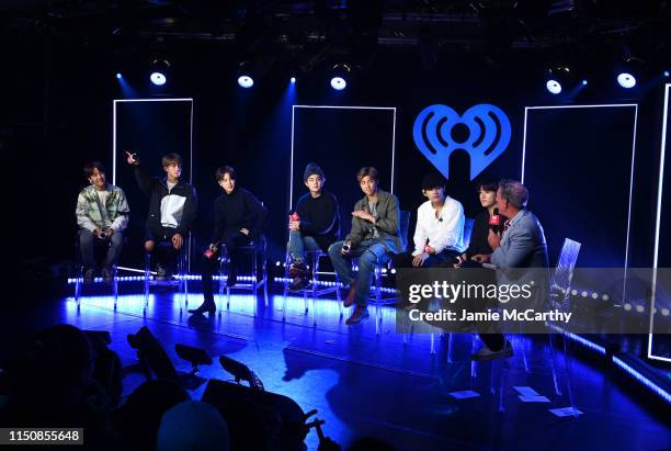 J-hope, Jin, Jimin, SUGA, RM, V, Jungkook of BTS appear onstage with Elvis Duran for iHeartRadio Live with BTS at iHeartRadio Theater New York on May...