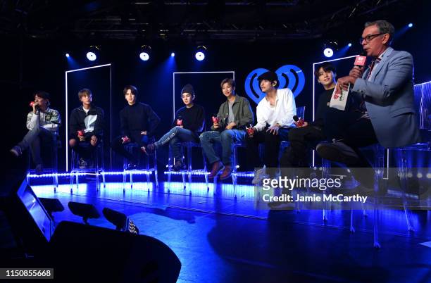 J-hope, Jin, Jimin, SUGA, RM, V, Jungkook of BTS appear onstage with Elvis Duran for iHeartRadio Live with BTS at iHeartRadio Theater New York on May...