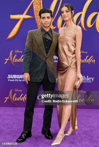 Mena Massoud and Laysla De Oliveira attend the premiere of Disney's "Aladdin" on May 21, 2019 in Los Angeles, California.