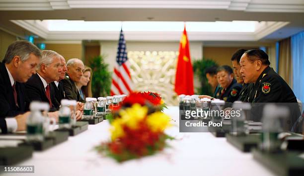China's Defence Minister Liang Guanglie meets U.S. Secretary of Defense Robert Gates at the 10th International Institute for Strategic Studies Asia...