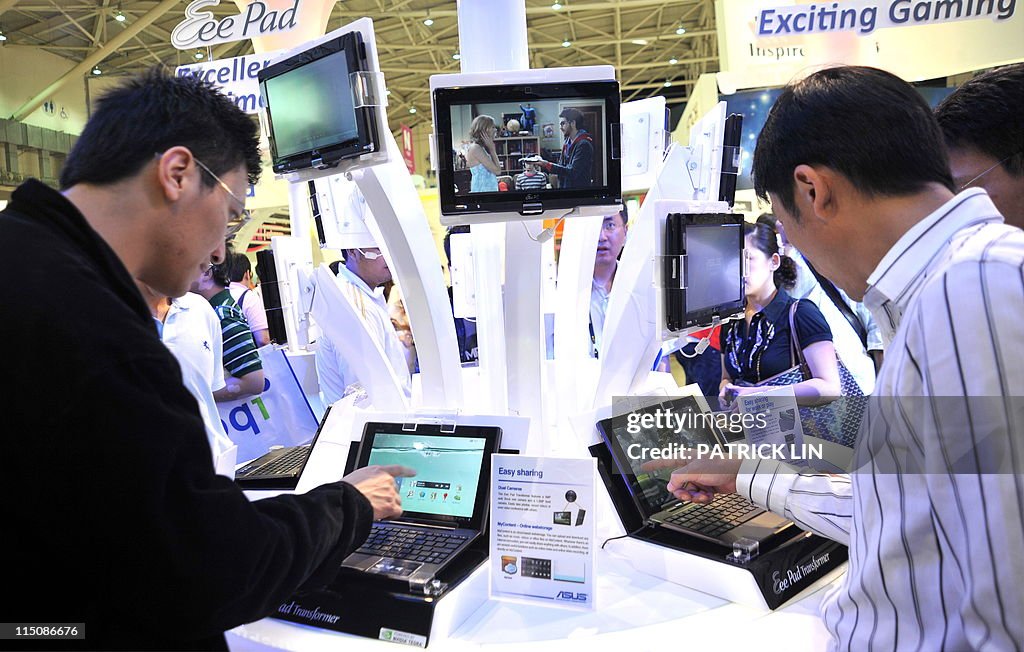 Visitors check various types of tablet c