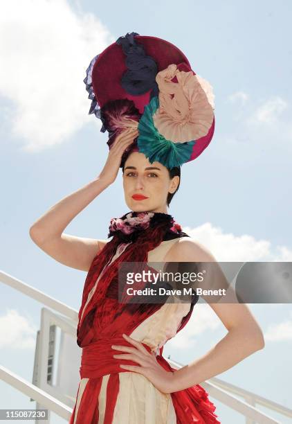 Model Erin O'Connor poses wearing a hat by Louis Mariette and a bespoke dress by Felicity Brown created for this occasion during Investec Ladies Day...