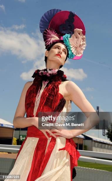 Model Erin O'Connor poses wearing a hat by Louis Mariette and a bespoke dress by Felicity Brown created for this occasion during Investec Ladies Day...